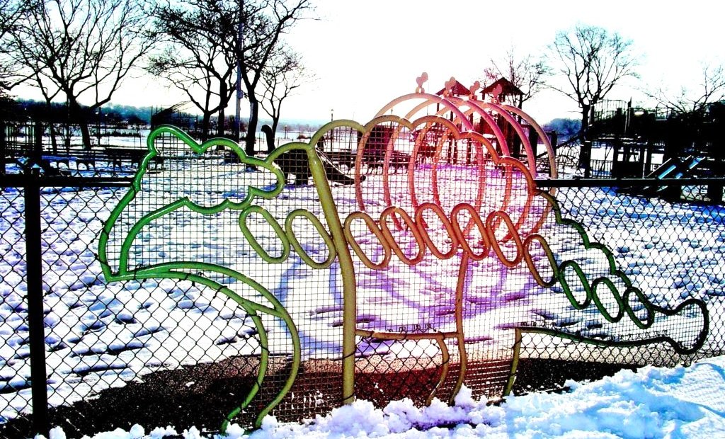 Dinosaur fence panel in bent tube shading from green through orange to pink